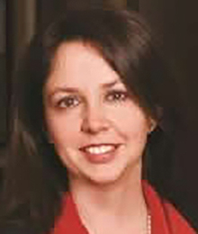 Leslie Kroeger Leslie Kroeger, close up shot of Caucasian woman with brown hair, wearing a red collared shirt