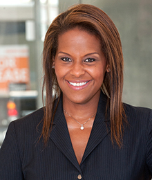 Michelle Delancy Michelle Delancy headshot, a smiling African American woman wearing a black suit, pictured in front of a window